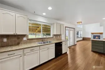 Streamlined kitchen with granite counters- plenty of space for a butcher block kitchen island too!