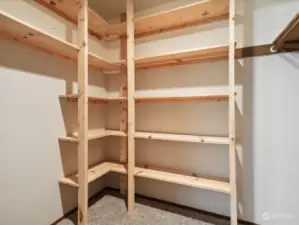 Primary bedroom features built-in shelving.