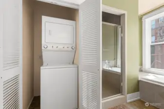 The laundry center is located in the bathroom.