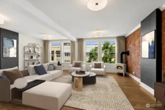 The living room showing the wall-to-wall windows that frame your views of downtown Tacoma.