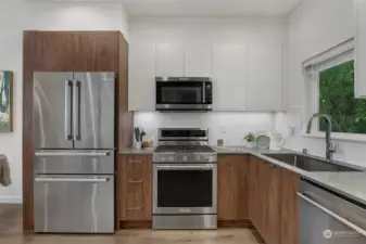 Modern kitchen with stainless steel appliances.