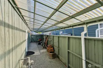 Side of home storage with access to garage.