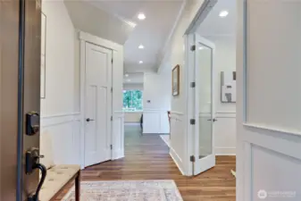 Beautiful millwork and trim throughout the home, high ceilings, and new wide plank LVP throughout the downstairs make this main floor shine.