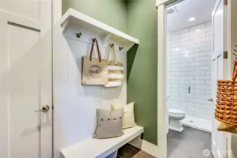 The mud room off of the garage flows into the main floor 3/4 bathroom.