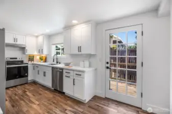 Direct kitchen access to deck for easy entertaining and grilling if you'd like