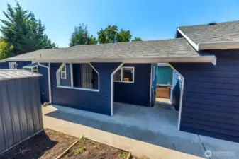 Covered walkway between the detached garage and entry to the home.