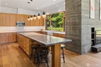 Culinary sanctuary with oversized zinc island for all your gatherings.