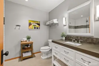 Bathroom two is across from bedroom two and next to bedroom three.