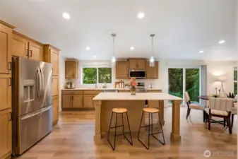 Bright, upgraded kitchen with quartz countertops and premium appliances
