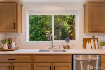 Enjoy serene wooded views right from your sink