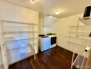 You will love all the space in the laundry/pantry area.  Plenty of room for all your canned goods and paper products.  Washer and dryer stay!