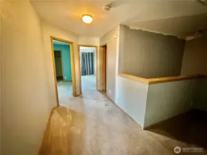 View down the hall looking toward the additional 2 bedrooms.