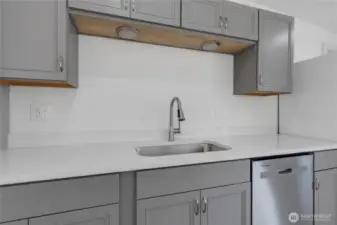 Undermount sink, and under cabinet lighting.