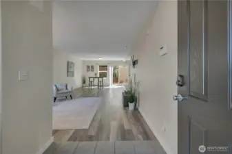 Come on in. Powder room and 2 closets tucked away to the left of the entrance.
