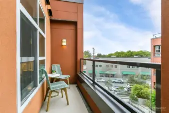 Private deck overlooking the community courtyard. Sweet place for your morning coffee or whatever makes you happy.