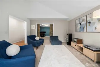 Another view of living room looking into formal dining, separated by barn doors.