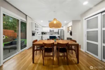 Eating space next to kitchen. Sliding doors on the left to backyard. Pantry on the right.