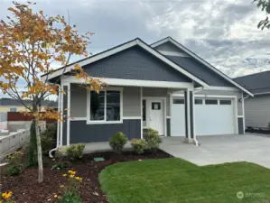 This is a picture of the actual home with a covered front porch.