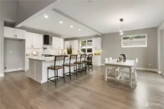 Large dining area off kitchen with gorgeous views of the lake