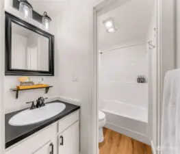 Full Bathroom with separate sink area - white and bright!