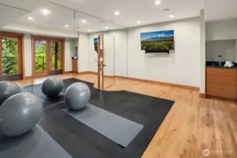 Wall of windows, wired for A/V, in-ceiling speakers and French doors to outside