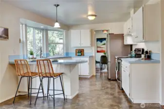 Full view of kitchen, looking towards dining room.