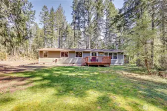 Nearly 2.5 acres, with golden afternoon light filtering through the trees.