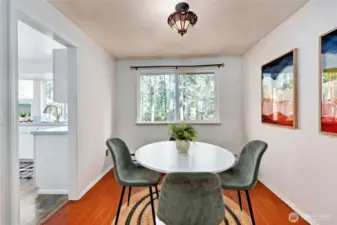 Dining room with window looking out onto the back of the property.