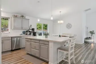 Kitchen is light and open to living room and dining area.