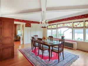 Here is the formal dining room with custom, stained-glass windows.
