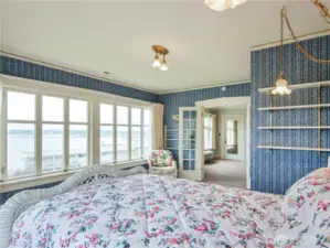 This is the primary bedroom with sweeping views of Bellingham Bay.