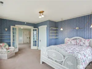 Original French doors and wood trip throughout the home.