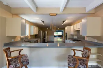 Large kitchen has all new KitchenAid appliances. French doors lead to a very large bonus room in distance over 700 sq feet off kitchen.