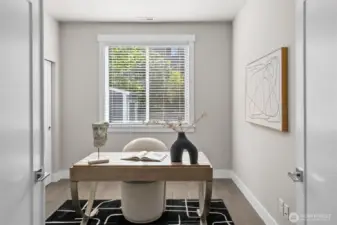 Desirable main floor bedroom offers incredible versatility, ideal as a home office, flex space, or suitable for multi-generational living.