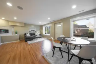 The expansive bonus room is located on the lower level and features a gas fireplace, wood floors, wet bar, and access to the fully fenced grounds.