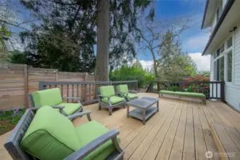 The entertainment sized deck is conveniently located off of the dining and living areas providing endless possibilities for entertaining and outdoor relaxation.