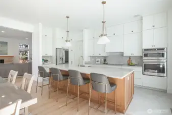 The newly remodeled kitchen has been tastefully designed for the most discerning cooks as well as large gatherings with quartzite counters, extra long island, custom pendant lighting and stainless steel appliances.