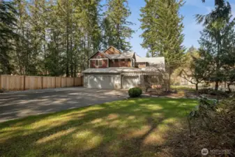 Oversized 3-car garage is great for your  summertime water toys! Lots of off-street  parking + room for smaller RV parking to the  left of the garage pad.