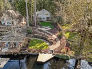 A Birdseye vision of all the opportunity for  outdoor living - on Covington Creek with  quick access to Lake Sawyer!  (boat house to the left belongs to the  neighboring property)