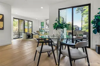 Large area off the kitchen for an informal table. Sliding door leads to the dedicated BBQ deck with gas stub. There's a second gas stub located on the covered dining patio (to the left) off the family room.