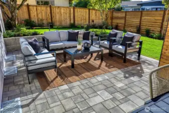 Great oversized paver patio designed with entertaining and casual conversation in mind. Once you step outside, this backyard will literally invite you to take a deep breath and encourage you to relax. You'll feel your energy shift as you realize this is what home-sweet-home is all about!