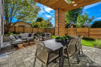 Covered outdoor dining with overhead heat and two speakers. Fully fenced backyard with views of the resident Dogwood tree. It's leaves are gorgeous in the spring as they are blooming and full of color.