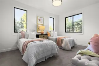 Two additional bedrooms are very spacious and include walk-in closets already trimmed with custom shelving, hanging options, and a drawer bank.