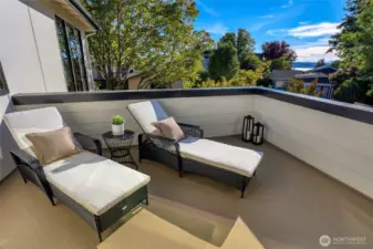 Upper-level deck located off the bonus room captures filtered lake and mountain views. Lay back and soak in a sunset, or lounge like you're on vacation.