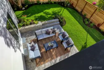 View of the picturesque backyard from the bonus room deck.