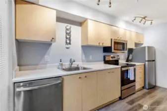 Full Kitchen makes it a joy to cook. bonus wine rack above the sink