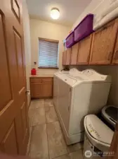 Laundry room with folding table & cabinets