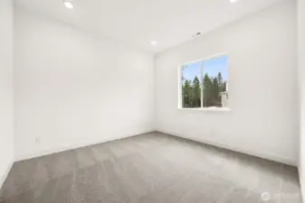 Second Primary Bedroom with 3/4 bath  Photos are of a different home. Standard finishes and features are similar and can be modified.