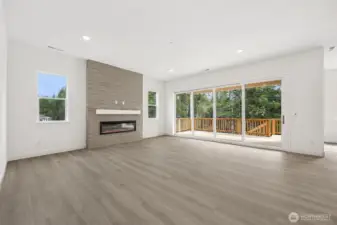 Great Room with multi-slide doors. Photos are of a different home. Standard finishes and features are similar and can be modified.