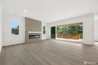 Great Room with multi-slide doors. Photos are of a different home. Standard finishes and features are similar and can be modified.